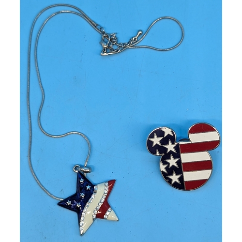 182 - An official Mickey Mouse badge and stars and stripes necklace