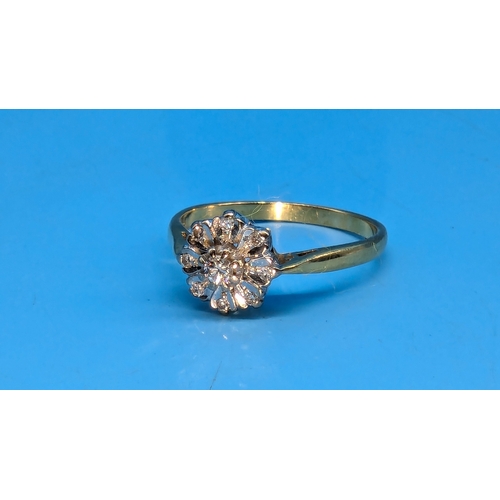 206 - An 18ct Gold and Diamond Daisy Illusion Ring.