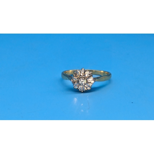 206 - An 18ct Gold and Diamond Daisy Illusion Ring.