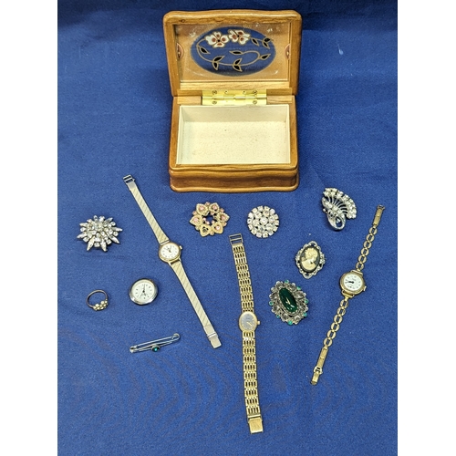 249 - A quantity of costume jewellery and watches in a box