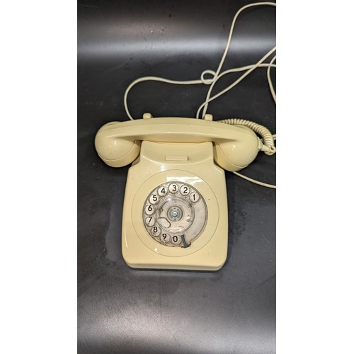 1136 - An Ivory Coloured Rotary Telephone.