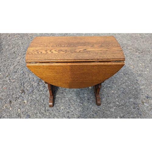 1237 - An Oak Twist Top Folding  Occasional Table  56cm x 75cm x 47cm Extended