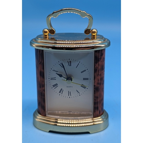 187 - A Howard Millar Quartz Brass carriage clock