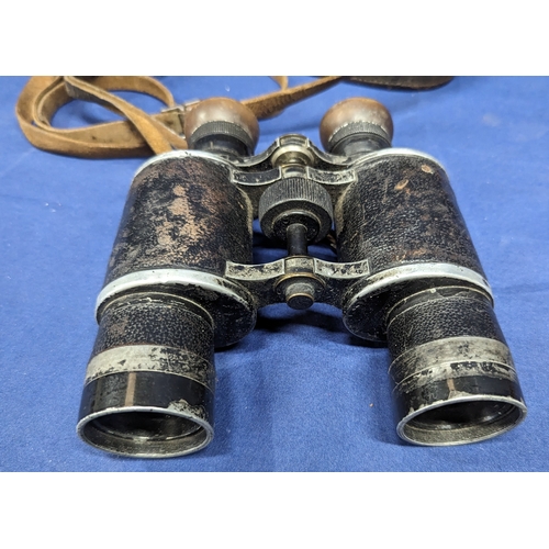 407 - A Pair of Schute Cassel binoculars with leather case