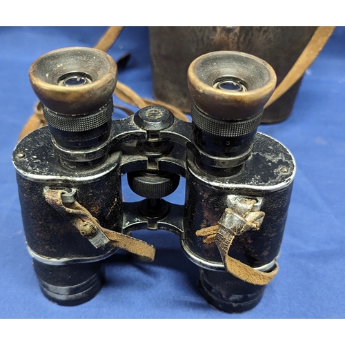 407 - A Pair of Schute Cassel binoculars with leather case