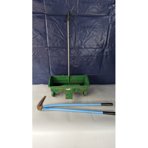 1221 - A seed spreader and lawn edger shears