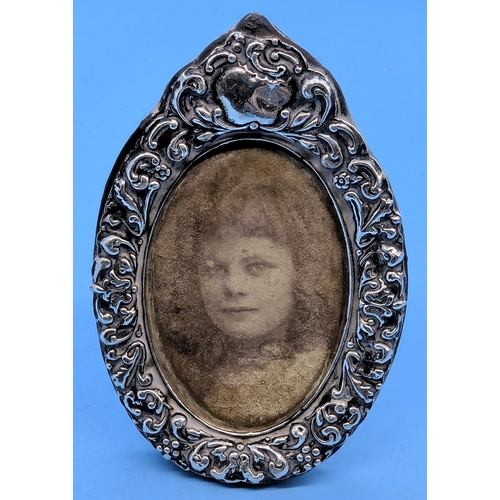 252 - A Silver Mounted Oval Picture Of A Young LAdy