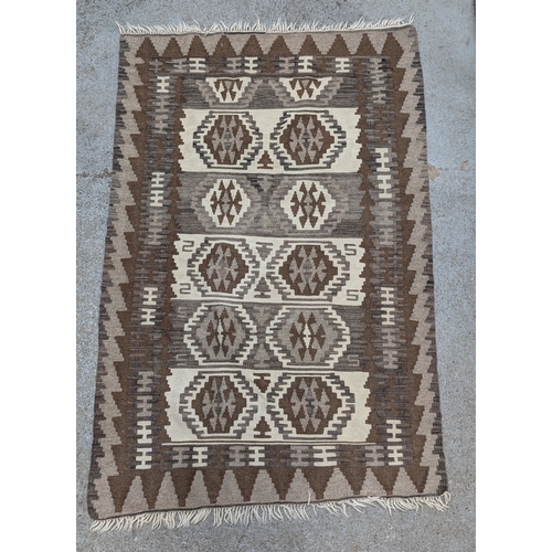 56 - An Afghan Kilim Rug in Beige, Cream and Browns - 104 x 156cm