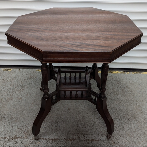 57 - An Edwardian Octagonal Occasional Table on Castors - 72 x 74 x 74