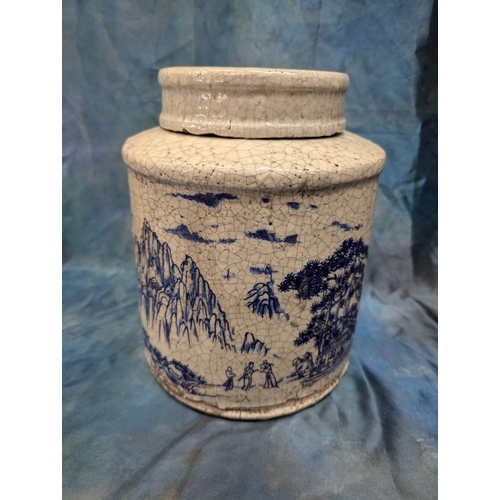 11 - A Large Chinese Crazed Glaze Tea Jar Depicting Mountain Scenes