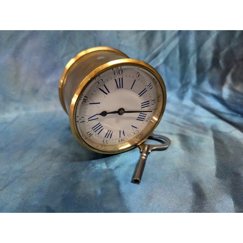 9 - A Brass Drum Clock With Roman Numerals - Running With Key 10cm Diameter