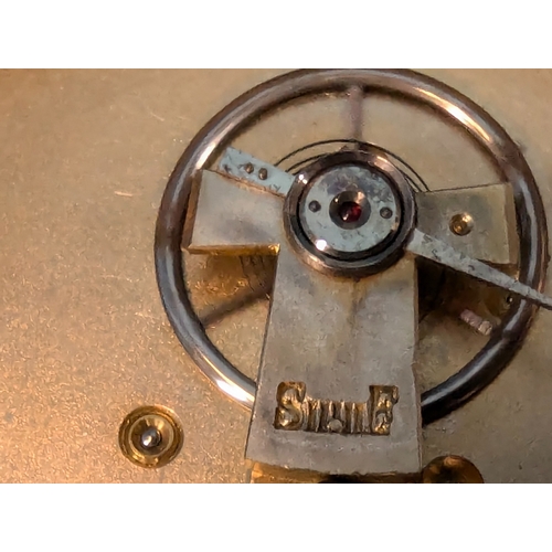 9 - A Brass Drum Clock With Roman Numerals - Running With Key 10cm Diameter