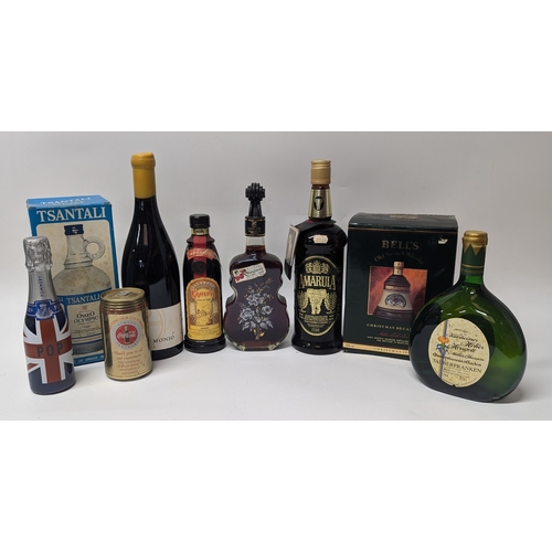 116H - Selection Of Mixed Drinks Including: 2 Bottles Of Wine, 3 Liqueurs, Ouzo And Collectors Bells, Pomme... 