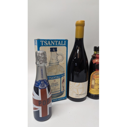 116H - Selection Of Mixed Drinks Including: 2 Bottles Of Wine, 3 Liqueurs, Ouzo And Collectors Bells, Pomme... 