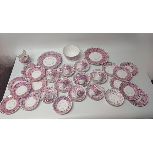 150 - A Collection of Antique Staffordshire Pink Lustre Rose Pattern Cups and Saucers, Plates, Bowl, Cake ... 