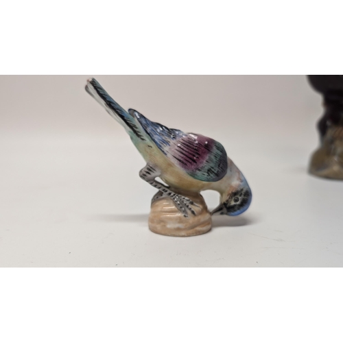 165 - Antique Figurines inc. 
-  Meissen Parrot 7cm Tall
- Staffordshire Cow 4cm Tall
- Majolica Rooster m... 