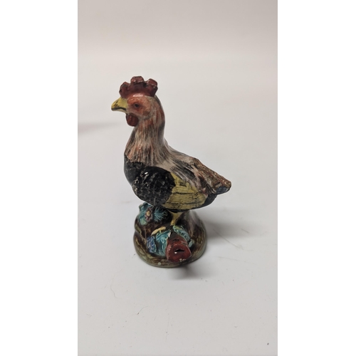 165 - Antique Figurines inc. 
-  Meissen Parrot 7cm Tall
- Staffordshire Cow 4cm Tall
- Majolica Rooster m... 