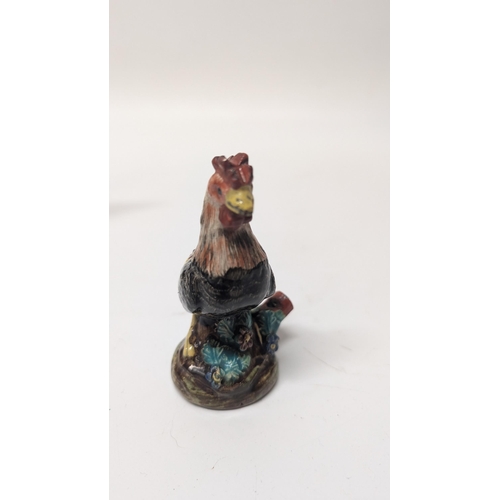 165 - Antique Figurines inc. 
-  Meissen Parrot 7cm Tall
- Staffordshire Cow 4cm Tall
- Majolica Rooster m... 