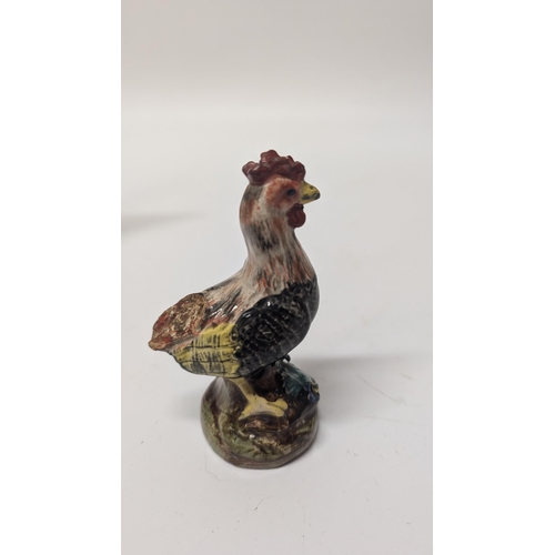 165 - Antique Figurines inc. 
-  Meissen Parrot 7cm Tall
- Staffordshire Cow 4cm Tall
- Majolica Rooster m... 