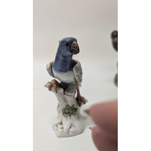 165 - Antique Figurines inc. 
-  Meissen Parrot 7cm Tall
- Staffordshire Cow 4cm Tall
- Majolica Rooster m... 