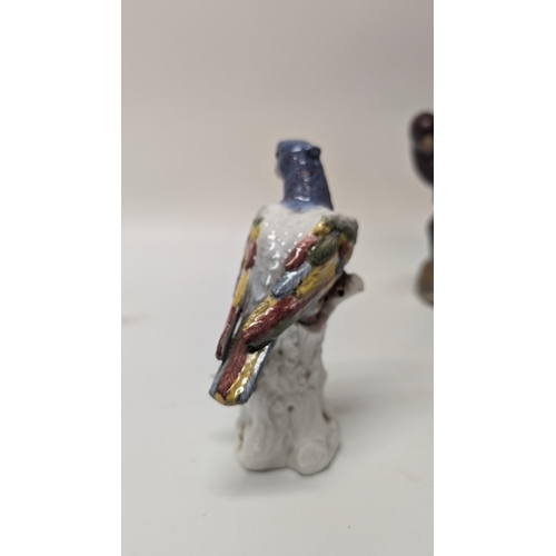 165 - Antique Figurines inc. 
-  Meissen Parrot 7cm Tall
- Staffordshire Cow 4cm Tall
- Majolica Rooster m... 