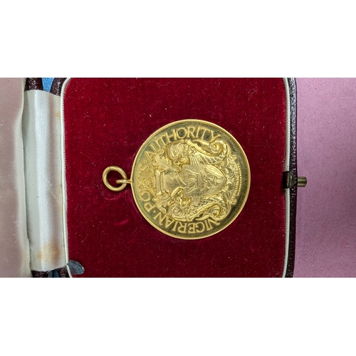 25 - The O.B.E, 9ct Gold Nigerian Port Authority Medallion, National Planning Committee For Independence ... 