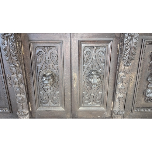 29 - A Heavily Carved Victorian Oak Jacobean Style Buffet Sideboard ( in 2 x parts) 196cm W x 63cm D x 22... 