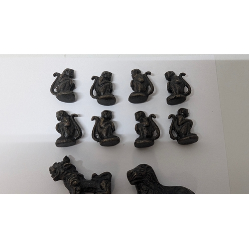 747 - An Amazing  set of Animal Chess Pieces in believed to Bronze in a metal folding board with pieces in... 