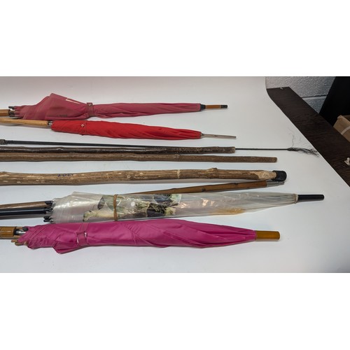 744 - 4 x Walking Sticks and 4 x Umbrellas