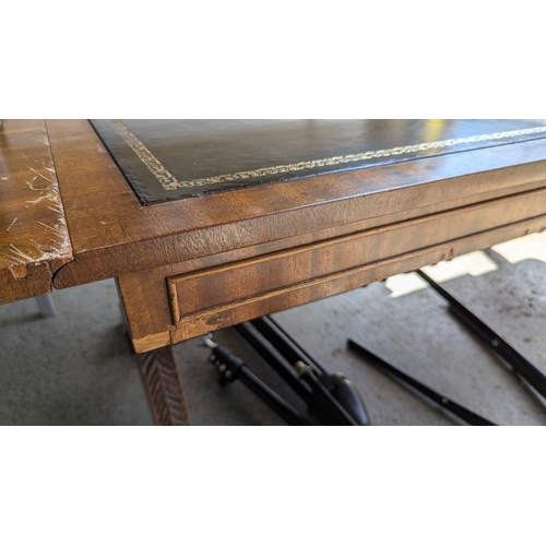 305 - A Leather topped drop leaf coffee table (some scratches pictured)