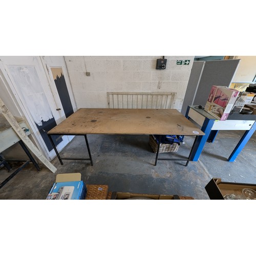 1029 - 2 x Metal Stands supporting a 2.44 mtr x 1.22mtr Wayrock Board used as packing table **TRADE SALE VA... 