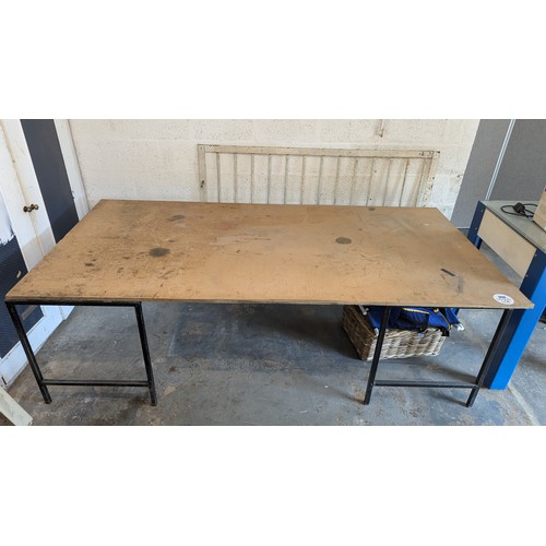 1029 - 2 x Metal Stands supporting a 2.44 mtr x 1.22mtr Wayrock Board used as packing table **TRADE SALE VA... 