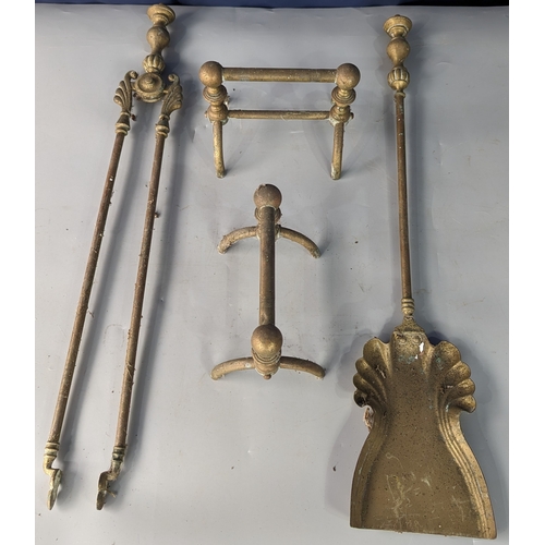 950 - A pair of Brass fire dogs with a set of fire tongs and shovel