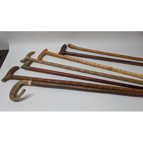 988 - 7 x Wooden Walking Sticks , various handles inc. Metal and Bone