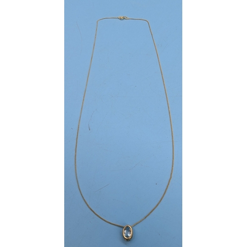 231 - A 9ct Gold Blue Topaz Pendant Necklace