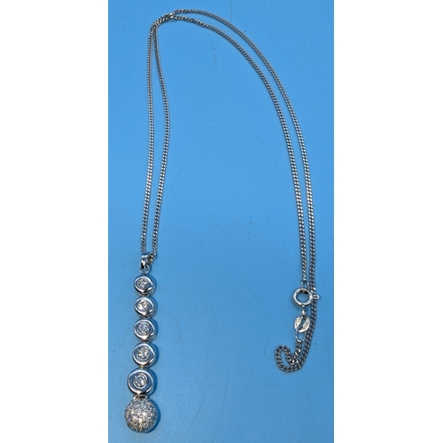 210 - An 18ct White Gold And Diamond Pendant With 5x Graduated Diamonds And Diamond Encrusted Ball Droplet