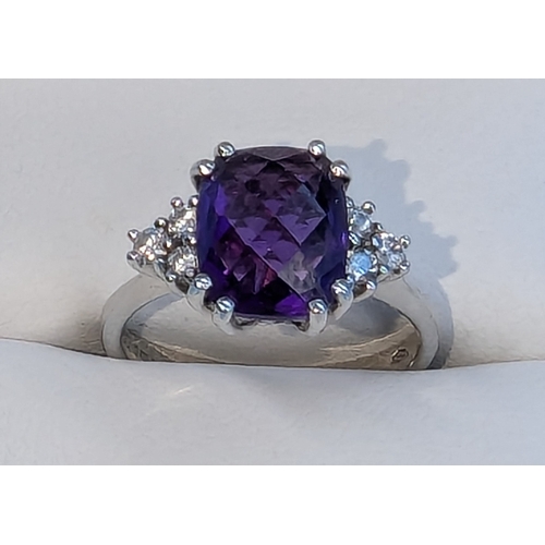 215 - An 18ct White Gold And Amethyst Ring With Diamond Accents To The Shoulders