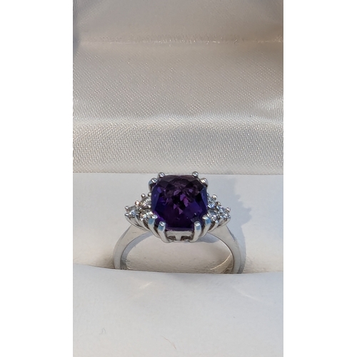 215 - An 18ct White Gold And Amethyst Ring With Diamond Accents To The Shoulders