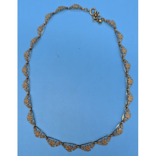 218 - A 9ct Gold 'Marked Foreign' Leaf Design Necklace - 10gms