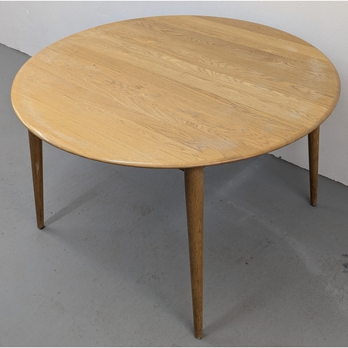 133 - An Ercol Style Round Dining Table - 120 x 74cm