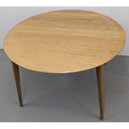 133 - An Ercol Style Round Dining Table - 120 x 74cm