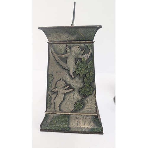 91 - Huntley and Palmer Biscuit Tin 1913 in the form of a Stone Column with Winged Cherubs, Bats and Bird... 