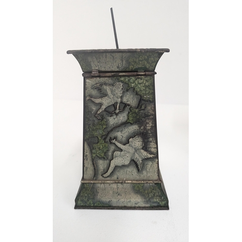 91 - Huntley and Palmer Biscuit Tin 1913 in the form of a Stone Column with Winged Cherubs, Bats and Bird... 