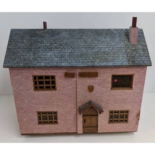 144 - A Dolls House with a Large Quantity of Furniture and accessories. 63.5cm Wide and 55cm High, 32cm De... 