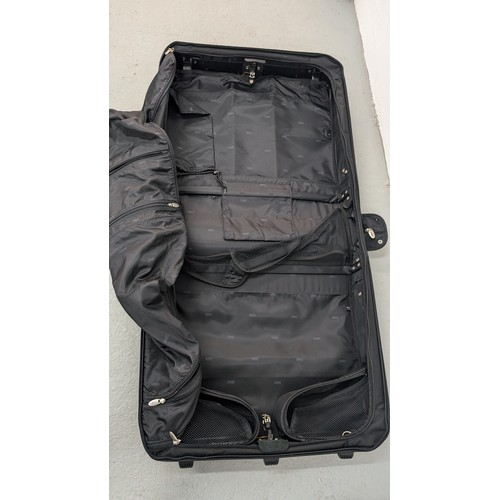 140 - A Dakota Large Black Rolling Garment/ Wardrobe Bag.  Excellent Condition.  Approx 60cm Tall, 60cm Wi... 