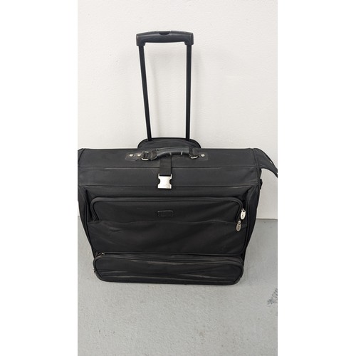 140 - A Dakota Large Black Rolling Garment/ Wardrobe Bag.  Excellent Condition.  Approx 60cm Tall, 60cm Wi... 