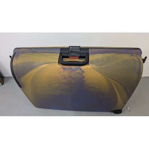 937 - Carlton Hardshell Suitcase - Good Condition  60cm High, 72cm Wide, 22cm Depth.  Comination Code 747