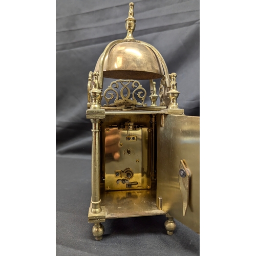 19 - A French Brass Lantern Clock with Key - Running 27cm Tall