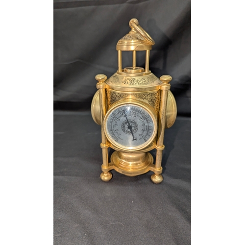 75 - A Triple Faced Clock, Barometer, Thermometer and Compass 25cm High