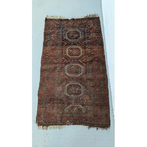 106 - An Antique Persian BALUCH Hand Made Wool Rug   - worn in places 137cm x 84cm